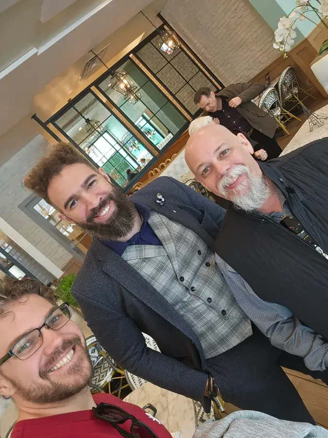 Michael with two men at an event