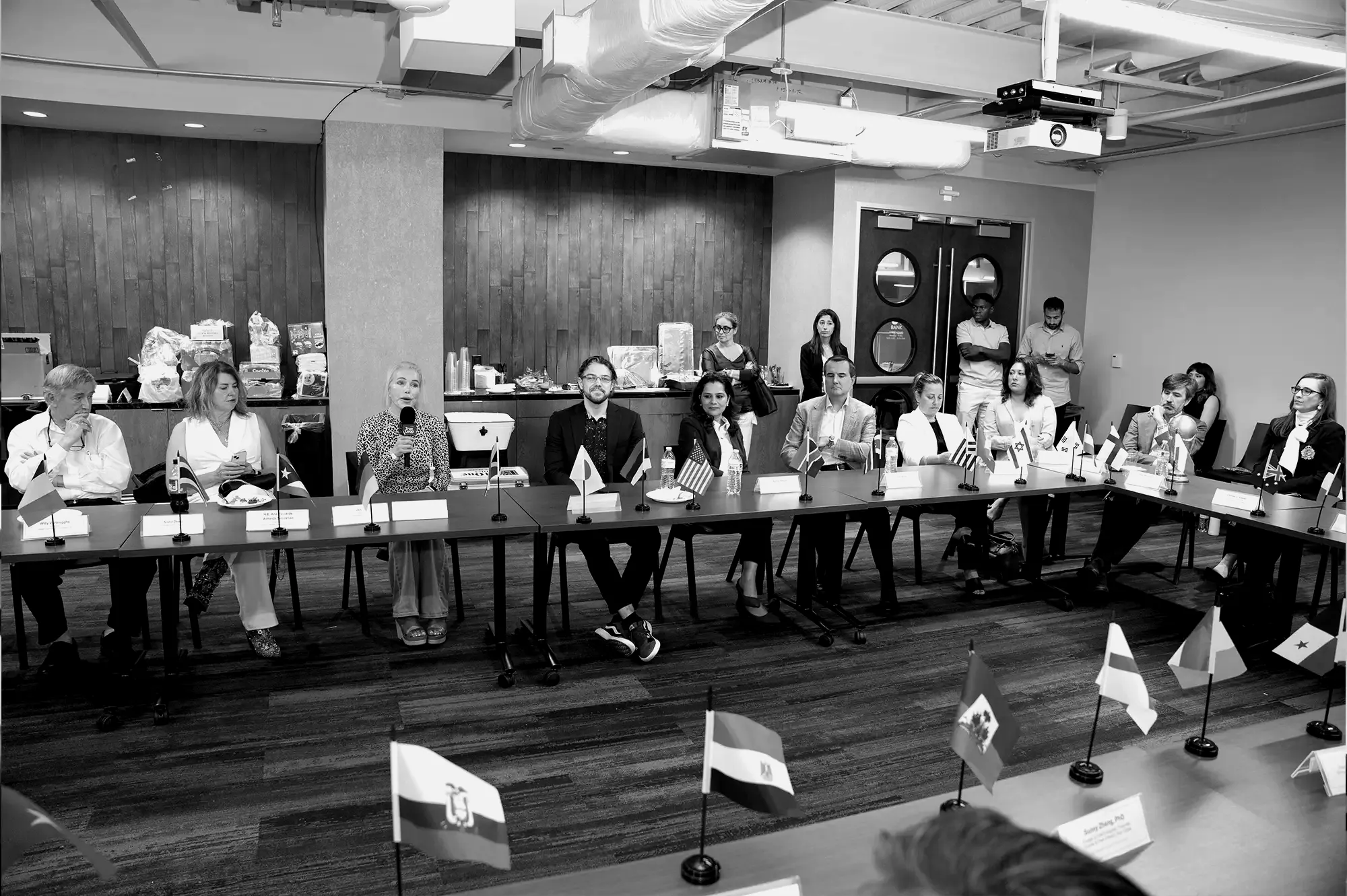 A boardroom in Houston with people seated around the table