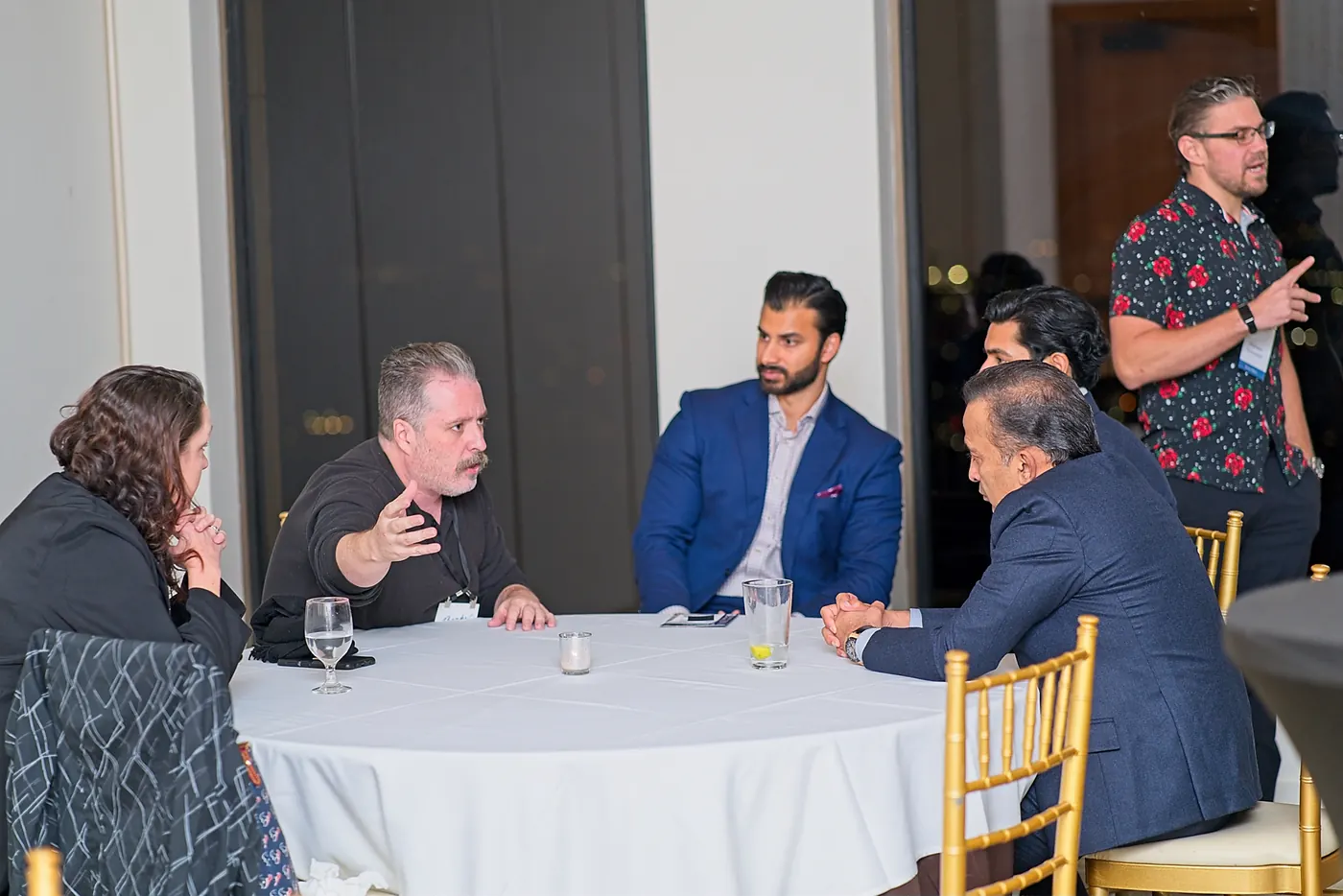 Michael Griswold talking with guests at an Accredited Capitalists event in Houston