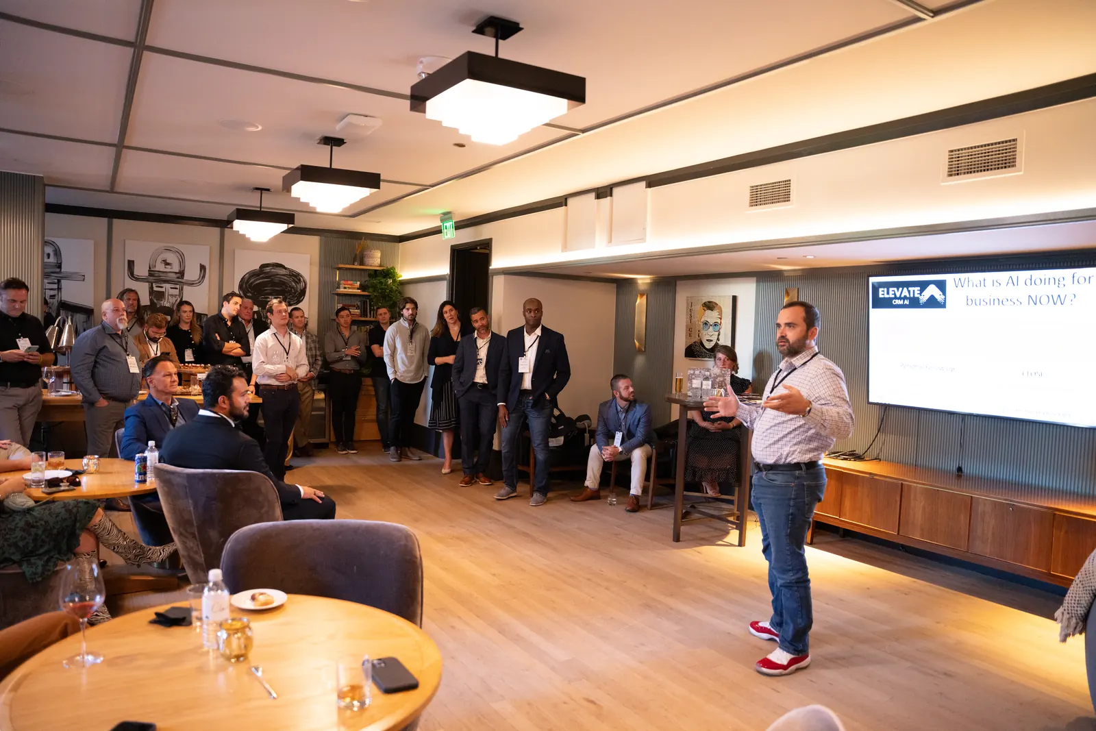 A speaker and a full room at one of Michael's investor events